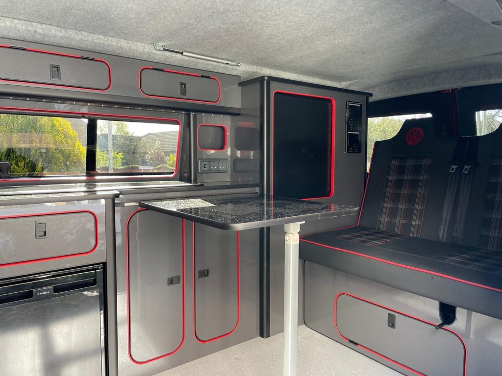 A VW T6 camper seats 4-5 and can sleep 4 comfortably